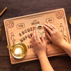 flat-lay-hands-using-ouija-board-tool (2)