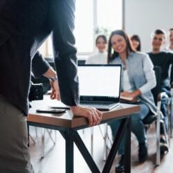 man-have-question-hand-raised-up-group-people-business-conference-modern-classroom-daytime_146671-16286