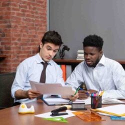 front-view-two-hardworking-businessmen-discussing-project-work (2)