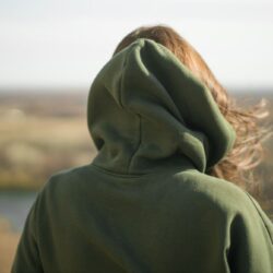 rear-view-of-trendy-young-woman-in-dark-green-hood-2023_1